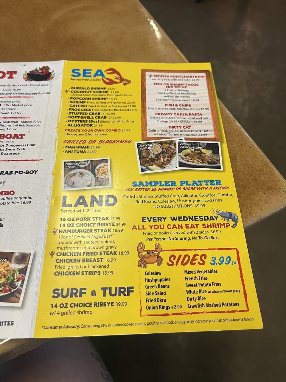 Printed seafood menu with Cajun and Creole sections.